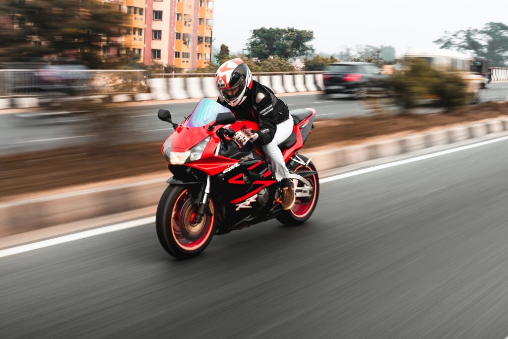 biker driving fast on highway