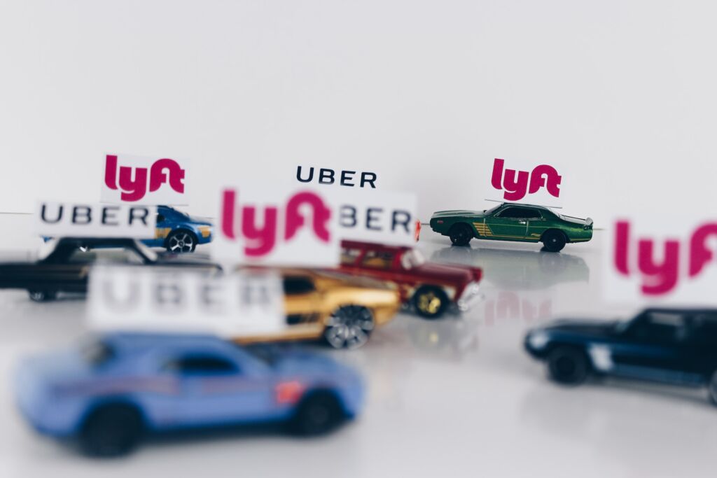 toy cars with uber and lyft flags