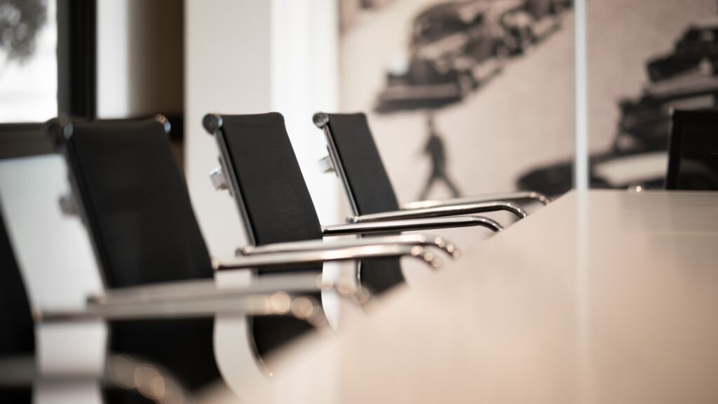 chairs at large table in conference room